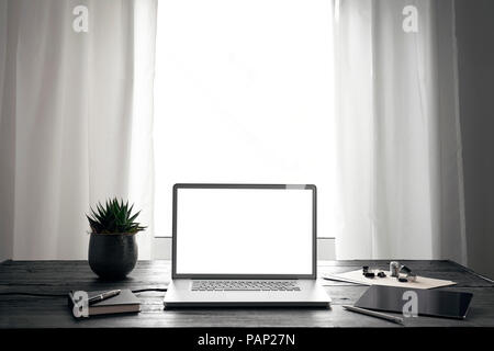 Modern office with laptop and digital tablet on desk Stock Photo