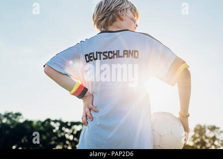 Boy wearing football shirt with Germany written on back Stock Photo