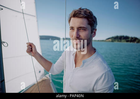 Portrait of a man on a sailing boat Stock Photo