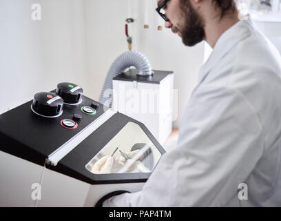 Chemical laboratory technician working in laboratory Stock Photo