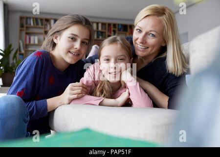 Mother and daughters having fun at home Stock Photo