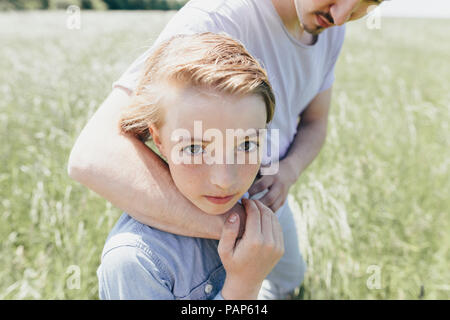 Portrait of boy and young man in a field Stock Photo