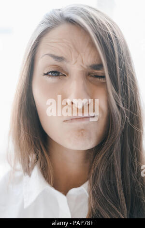 Portrait of a pretty, clever, young woman, winking Stock Photo
