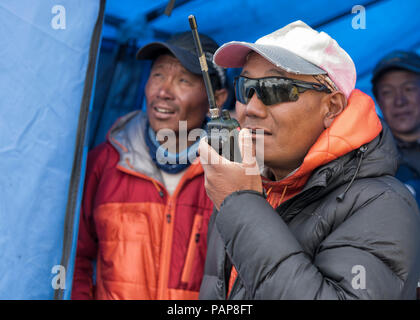 Nepal, Solo Khumbu, Everest, Sagamartha National Park, Man talking on a walkie talkie Stock Photo