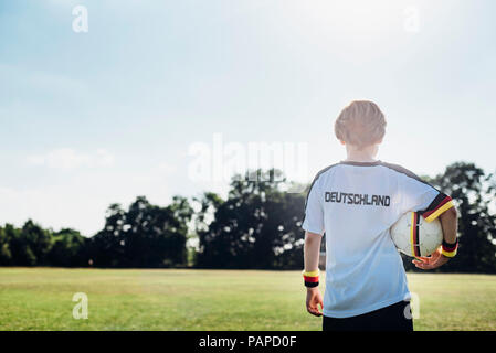 Boy wearing football shirt with Germany written on back Stock Photo