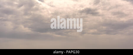 Dramatic sky background. Background of pastel clouds. Horizontal cloudscape photography. Texture of soft colored dramatic cloudy sky. Stock Photo