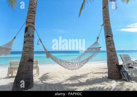 White Hammock Between 2 Palm Trees on Perfect, Scenic Paradise Beach - Panglao, Bohol - Philippines Stock Photo