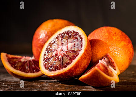 Whole and cut ripe juicy Sicilian Blood oranges Stock Photo