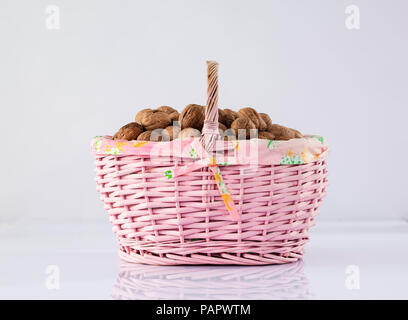 Nuts in basket Stock Photo