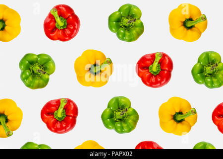 Top view pattern of fresh bright bell peppers on white background. Shot from above of multiple colorful paprika vegetables Stock Photo