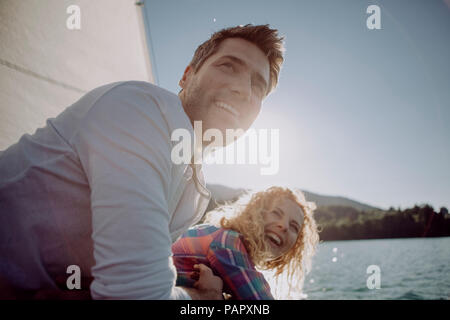 Happy couple on a sailing boat Stock Photo