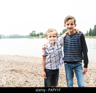 Portrait of two smiling boys embracing in the preschool Stock Photo - Alamy