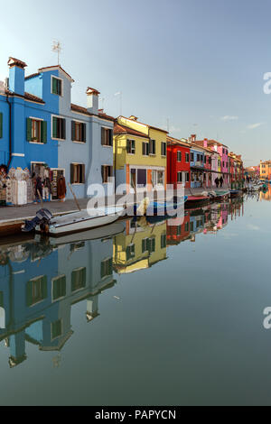 Italy, lagoon of Venice, Burano, boats on canal and colorful houses Stock Photo
