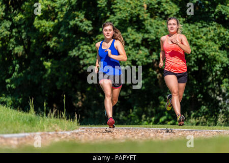 Female joggers on woodchip trail Stock Photo