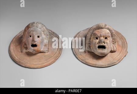 Two terracotta roundels with theatrical masks, Greek, Hellenistic