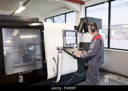 Stonemason working with CNC machine in his workshop Stock Photo