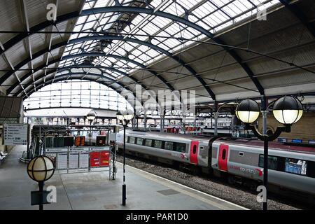 Cross Country train alongside the railway platform in the Newcastle central railway station, Newcastle upon Tyne, Tyne and Wear, England, UK, Western  Stock Photo