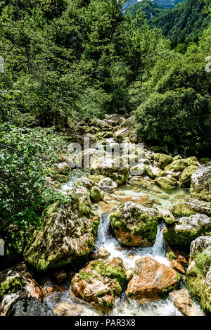 Idyllic mountain river in Lepena valley, Soca - Bovec Slovenia. Heading towards    Sunik water grove of river Lepenca. Beautiful landscape scene with  Stock Photo