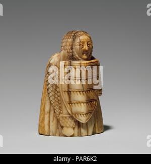 Rook or Pawn Chess Piece. Culture: Scandinavian. Dimensions: 1 7/8 × 1 1/4 × 7/8 in. (4.8 × 3.2 × 2.3 cm). Date: 12th century.  Armed and ready for battle, the standing warrior appears in full body mail and a long cloak. He hunches his shoulders slightly, as if from the weight of his armor, and yet has an open, almost smiling face. Museum: Metropolitan Museum of Art, New York, USA. Stock Photo