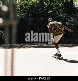 Cool young man in skateboarding skate park Stock Photo