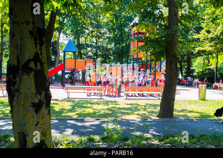 Kids camp standing in line, Large playground, big slide, Ciani Park, Lugano, Lake Lugano, Switzerland Stock Photo