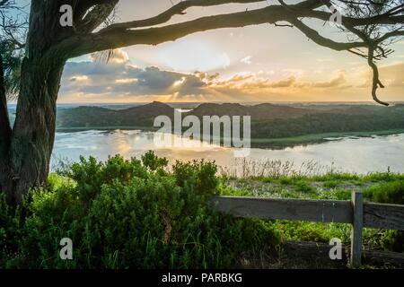 Sun setting behind the clouds in Tower hill wildlife reserve Stock Photo