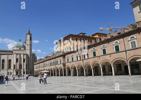 ASCOLI PICENO, ITALY - JUNE 02, 2014: The Gothic-style church of San Francesco (begun in 1258). The dome was completed in 1549. In the side portal is Stock Photo