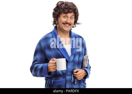 Guy in a bathrobe with a cup and a newspaper isolated on white background Stock Photo