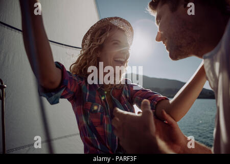 Happy couple on a sailing boat Stock Photo