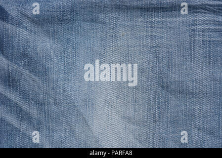 creased blue color  denim fabric background texture Stock Photo