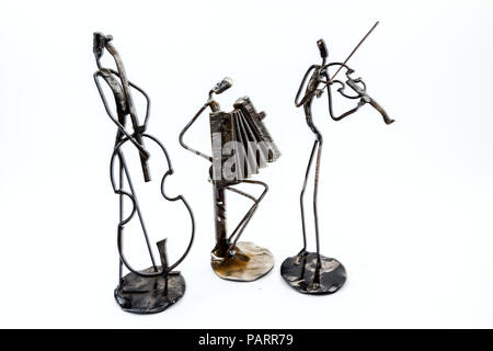 Figures of music performers are playing together, contrabass, accordion, and violin are playing together. Living lines Stock Photo