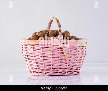 Nuts in basket Stock Photo