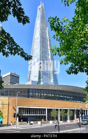 New Tooley Street modern exterior & entrance to London Bridge train station The Shard landmark skyscraper building Southwark South London England UK Stock Photo