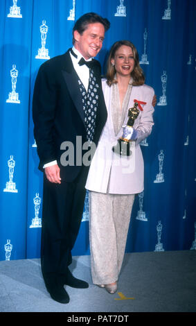 LOS ANGELES, CA - MARCH 30: Actor Michael Douglas and actress Jodie Foster attend the 64th Annual Academy Awards on March 30, 1992 at the Dorothy Chandler Pavilion in Los Angeles, California. Photo by Barry King/Alamy Stock Photo Stock Photo