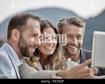 Smiling colleagues taking a selfie Stock Photo