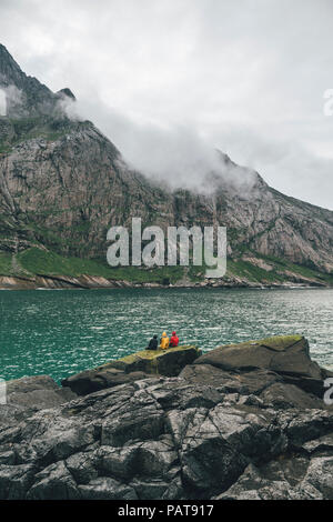 Norway, Lofoten, Moskenesoy, Young men fishing at Horseid Beach Stock Photo