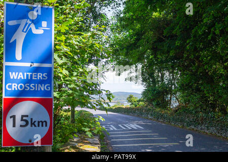 roadside or road side sign warning motorists of a traffic hazard of waiters on the road. Stock Photo