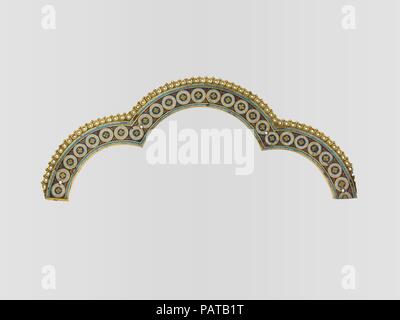 Tri-Lobed Arch from a Reliquary Shrine. Artist: Nicholas of Verdun and Cologne Followers. Culture: German. Dimensions: Overall: 4 1/4 x 11 x 1/8 in. (10.8 x 27.9 x 0.3 cm)  band width: 1 1/16 x 1/8 in. (2.7 x 0.3 cm). Date: ca. 1200.  A massive, golden shrine in Cologne Cathedral contains relics believed to be of  the biblical Three Kings who brought gifts of gold, frankincense, and myrrh to  the infant Jesus. The relics were acquired in Milan in 1164, and the goldsmith  Nicholas of Verdun was commissioned to create one of the most ambitious  reliquaries in Europe. This tiny arch, which comes  Stock Photo