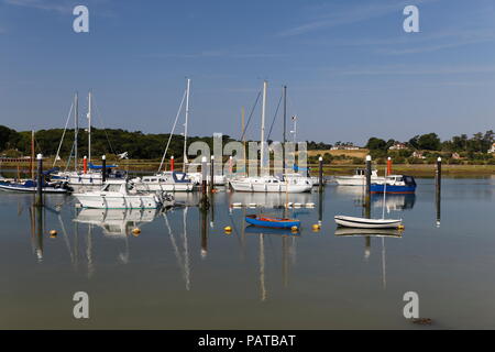 Sailboats reflected on the River Yar Yarmouth Isle of Wight Hampshire Stock Photo