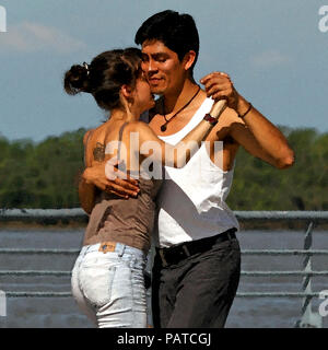 watercolored photograph of two young people dancing the tango.  in hold Stock Photo