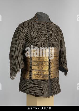 Shirt of Mail and Plate of Al-Ashraf Sayf ad-Din Qaitbay (ca. 1416/18-1496), 18th Burji Mamluk Sultan of Egypt. Culture: probably Egyptian. Dimensions: H. 31 in. (78.7 cm); W. 54 1/2 in. (138.4 cm); Wt. 25 lb. 2.4 oz. (11.41 kg). Date: ca. 1468-96.  Sultan Qaitbay (1416/18-1496) was one of the longest reigning Mamluk rulers of Egypt and a great patron of architecture. He is perhaps best remembered for building and renovating many mosques, shrines, citadels, and other monuments that still stand today in Saudi Arabia, Egypt, Syria, and Israel. This armor, one of only four Mamluk examples known t Stock Photo