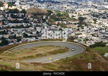 Beautiful aerial view of the San Francisco Twin Peaks overlooking the city's scenic skyline with numerous buildings and landmarks in the background Stock Photo