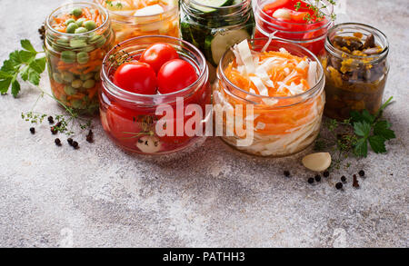 Fermented food. Preserved vegetables in jars Stock Photo