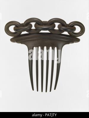 Hair Comb. Dimensions: 4 1/4 x 4 1/2 in. (10.8 x 11.4 cm). Manufacturer: Manufactured by India Rubber Comb Company. Patentee: Patented by Charles Goodyear (1800-1860). Date: ca. 1851. Museum: Metropolitan Museum of Art, New York, USA. Stock Photo