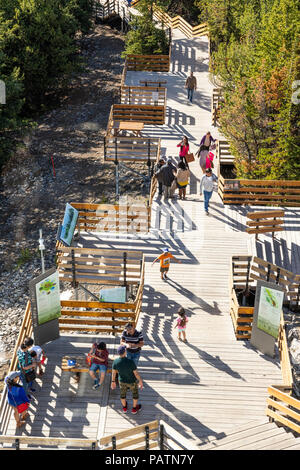 Tourists enjoying the views from the summit boardwalk on Sulphur Mountain in the Rocky Mountains, Banff, Alberta, Canada Stock Photo
