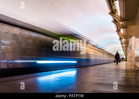 Subway metro train arriving at a station. Motion blurr effect Stock Photo