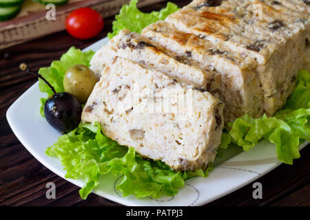 Thanksgiving Turkey dinner. Cupcake casserole with turkey meat and mushrooms close-up on a wooden table. The concept of food on thanksgiving. Stock Photo