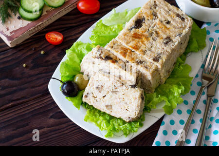 Thanksgiving Turkey dinner. Cupcake casserole with turkey meat and mushrooms on a wooden table. The concept of food on thanksgiving. Copy space. Stock Photo