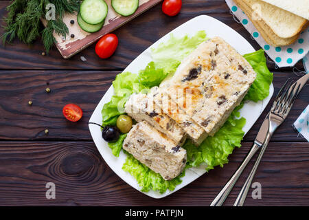 Thanksgiving Turkey dinner. Cupcake casserole with turkey meat and mushrooms on a wooden table. The concept of food on thanksgiving. Top view flat lay Stock Photo