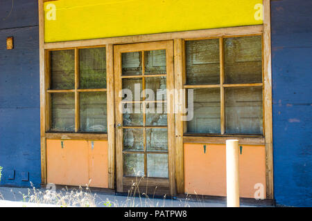 Weathered Front Of Boarded Up Shop Stock Photo